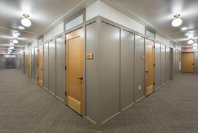 Portland apartment for rent - A long hallway with doors on both sides.