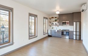 Portland apartment for rent - A kitchen with wooden floors and stainless steel appliances.
