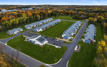 St Croix Falls apartment for rent - A large building complex surrounded by trees in autumn.