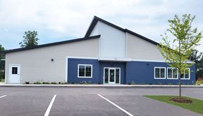 Hayward apartment for rent - A blue and beige building with a white door and windows.
