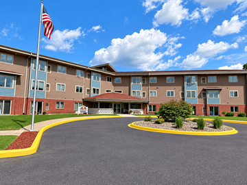 Altoona apartment for rent - A large building with a flag on top of a pole.