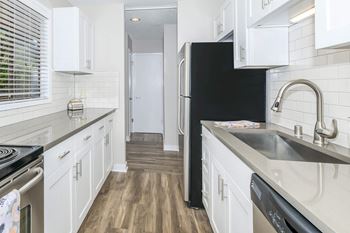 Wood plank flooring in select units*
