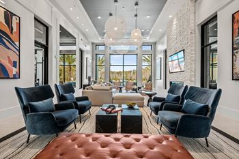 A living room with couches and chairs and a table