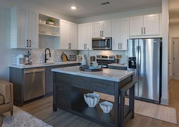 Quartz countertops w/ custom backsplashes
