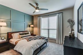 Woodstock apartment for rent - a bedroom with a bed and a ceiling fan