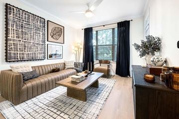 Atlanta apartment for rent - A living room with a brown sofa and a coffee table.
