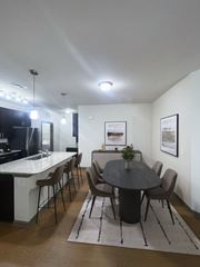 Greenville apartment for rent - A modern dining room with a round table and chairs.