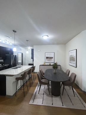 Greenville apartment for rent - A modern dining room with a round table and chairs.