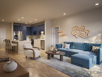 Bradenton apartment for rent - A modern living room with a blue couch and a wooden coffee table.