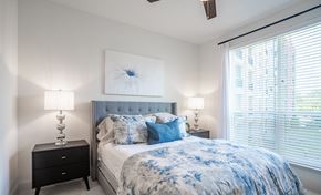 Atlanta apartment for rent - a bedroom with a bed and a large window