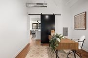 St. Louis apartment for rent - a sliding barn door separates the kitchen from the living room
