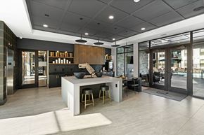 Bozeman apartment for rent - a large kitchen with a center island and chairs in a lobby
