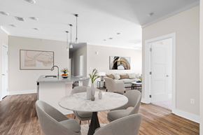 Oak Ridge apartment for rent - A modern dining room with a marble table and grey chairs.
