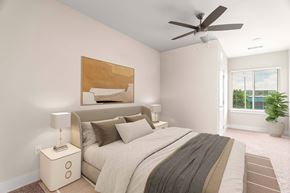 Oak Ridge apartment for rent - A bedroom with a bed, nightstand, and a ceiling fan.