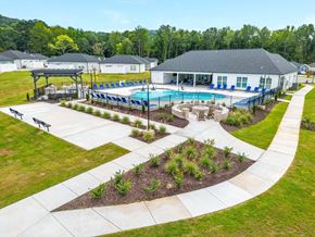 Chattanooga apartment for rent - an aerial view of a swimming pool with a house in the background