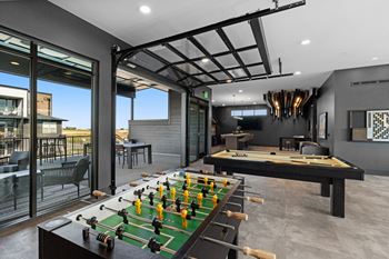 Clubhouse with multi-cade game, pool table, shuffleboard, sports simulator & more!