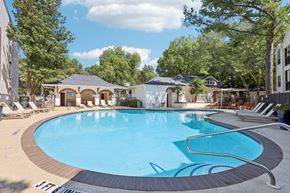 Atlanta apartment for rent - Atlanta, GA, Apartments Near Ponce City Market - Virginia Highlands - Swimming Pool with Spacious Sundeck, Lounge Chairs, Cabanas, and Trees.