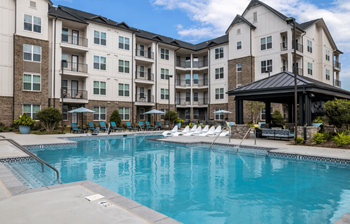 Resort-style pool with sun shelf and tanning ledge