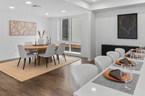 Bozeman townhouse for rent - A modern dining room with a large table and chairs.