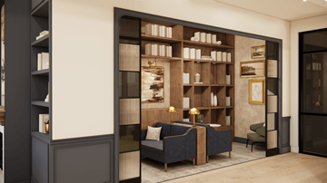 Huntersville apartment for rent - A living room with a dark blue couch and a bookshelf filled with books.