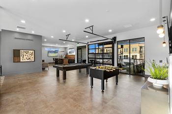 Clubhouse with multi-cade game, pool table, shuffleboard, sports simulator & more!