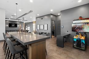 Bozeman apartment for rent - A modern dining area with a long table and chairs.