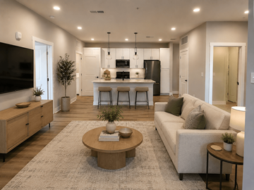 Gallatin apartment for rent - A modern living room with a kitchen in the background.