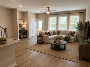Mauldin townhouse for rent - A living room with a couch, a coffee table, and a television.