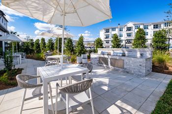 Gathering area with grills and corn hole