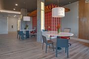 Antioch apartment for rent - a dining area with a round table and chairs and a large pillar with a wall