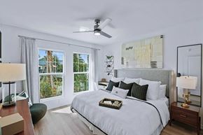 Land O' Lakes apartment for rent - a bedroom with a large bed and a ceiling fan at Altis Grand Suncoast, Land O' Lakes Florida
