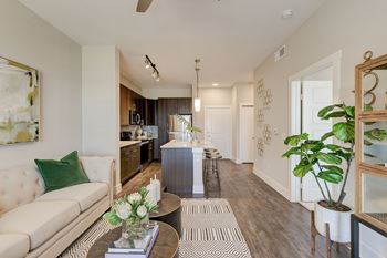 Faux hardwood-style flooring in living/dining areas, kitchens and entries