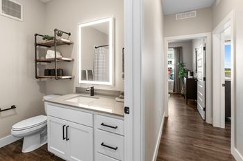 Resort style backlit mirrors in all bathrooms