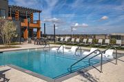 Antioch apartment for rent - Luxury Apartments Near Tristar Southern Hills Medical Center In Antioch, TN - Mainstead At Century Farms - A Sleek Rooftop Swimming Pool Featuring In-Water Lounge Chairs And A Modern Clubhouse.
