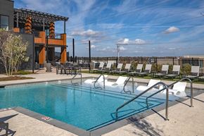 Antioch apartment for rent - Luxury Apartments Near Tristar Southern Hills Medical Center In Antioch, TN - Mainstead At Century Farms - A Sleek Rooftop Swimming Pool Featuring In-Water Lounge Chairs And A Modern Clubhouse.