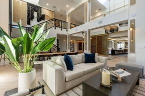 Coconut Creek apartment for rent - A living room with a couch, a table, and a potted plant.