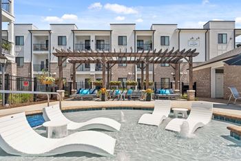 In-pool tanning ledge with pool lounge chairs