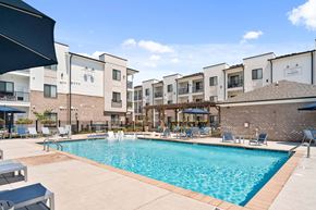 Oak Ridge apartment for rent - A swimming pool in front of apartment buildings.
