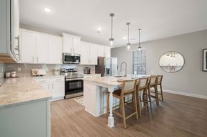 Mcdonough apartment for rent - A kitchen with a table and chairs.