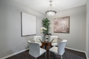 Decatur apartment for rent - A dining room with a glass table and white chairs.