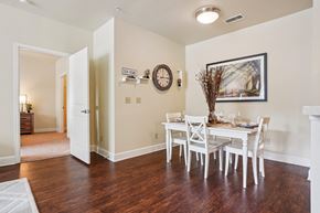 Woodland Park apartment for rent - A dining room with a white table and chairs.