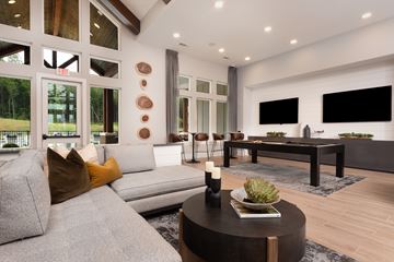 Fairburn apartment for rent - A modern living room with a grey sofa and a black coffee table.