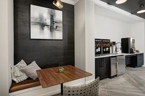 Franklin apartment for rent - A modern kitchen with a wooden table and a bench.