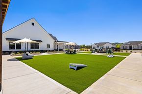 Lenoir City apartment for rent - A white building with a green lawn in front.