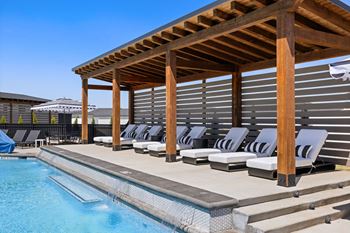 Swimming pool w/ multiple tanning decks