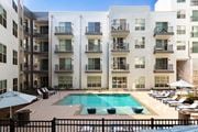 Decatur apartment for rent - a pool is in front of an apartment building