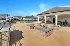 Chattanooga apartment for rent - the clubhouse has a patio with a fire pit and a pool