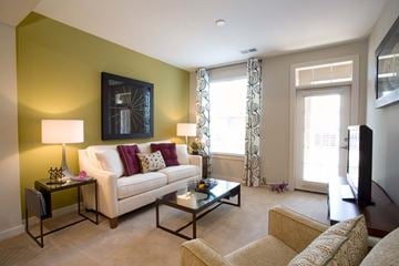Charlotte apartment for rent - A living room with a white couch and a coffee table.