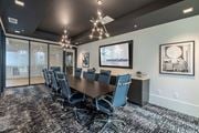 Huntsville apartment for rent - A conference room with a long table and chairs.