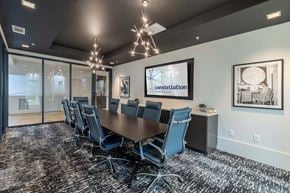 Huntsville apartment for rent - A conference room with a long table and chairs.